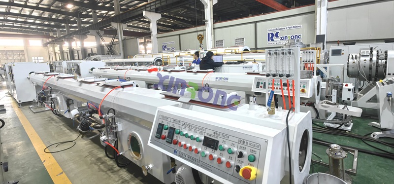 XinRong HDPE Pipe Extrusion Line model with tractor and vacuum calibration system - professional plastic machinery manufacturer.jpg